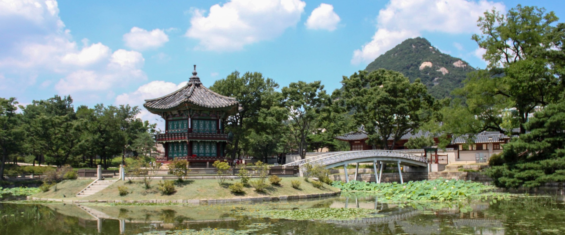Traditional Korean pavilion Hyangwonjeong with reflection on a pond at Gyeongbokgung Palace in Seoul, South Korea